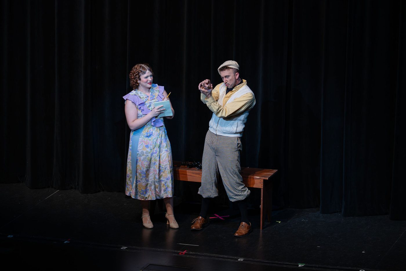 A two-hander played downstage in front of the curtain