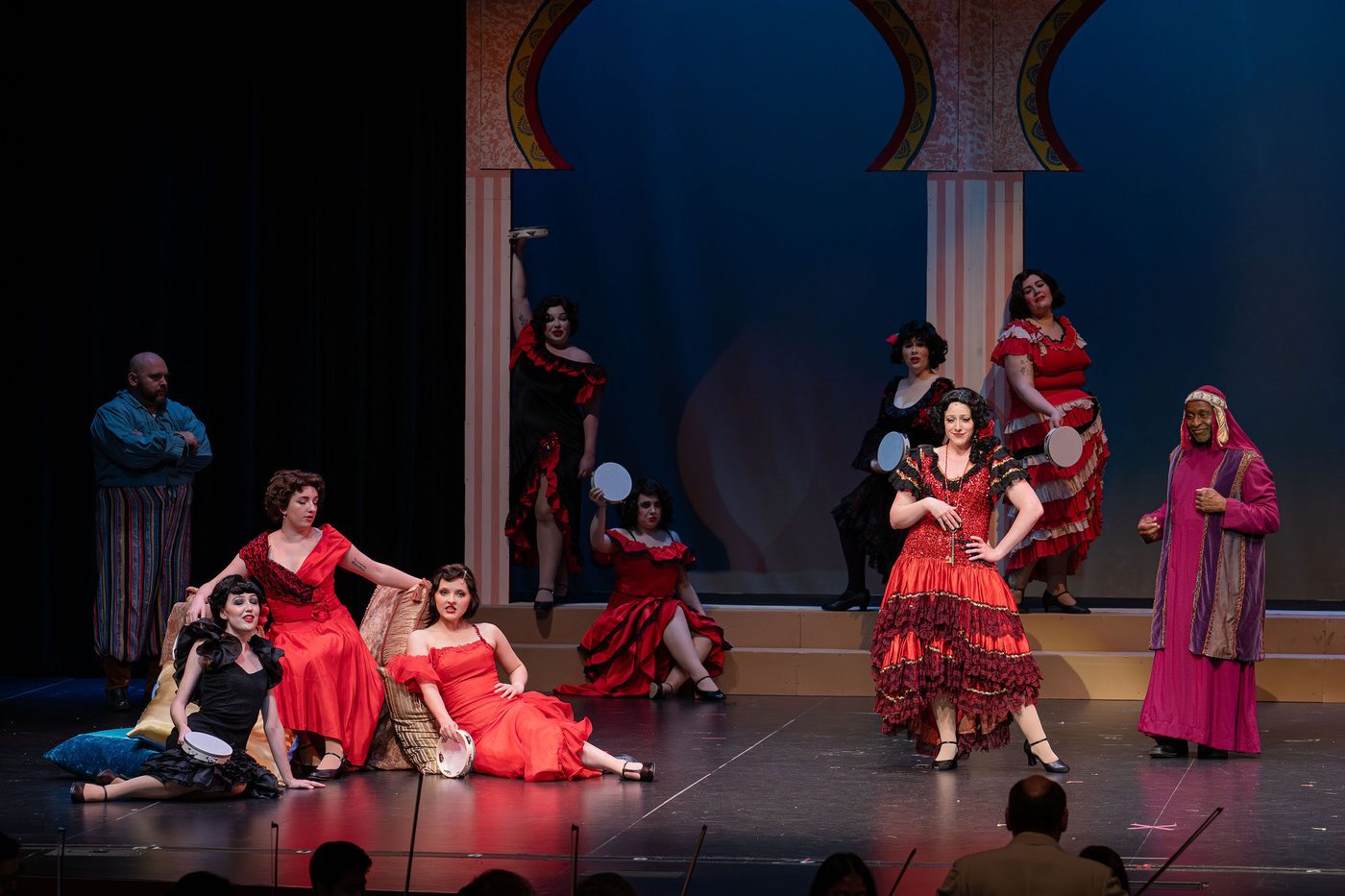 Red skirts and tambourines in the cafe number