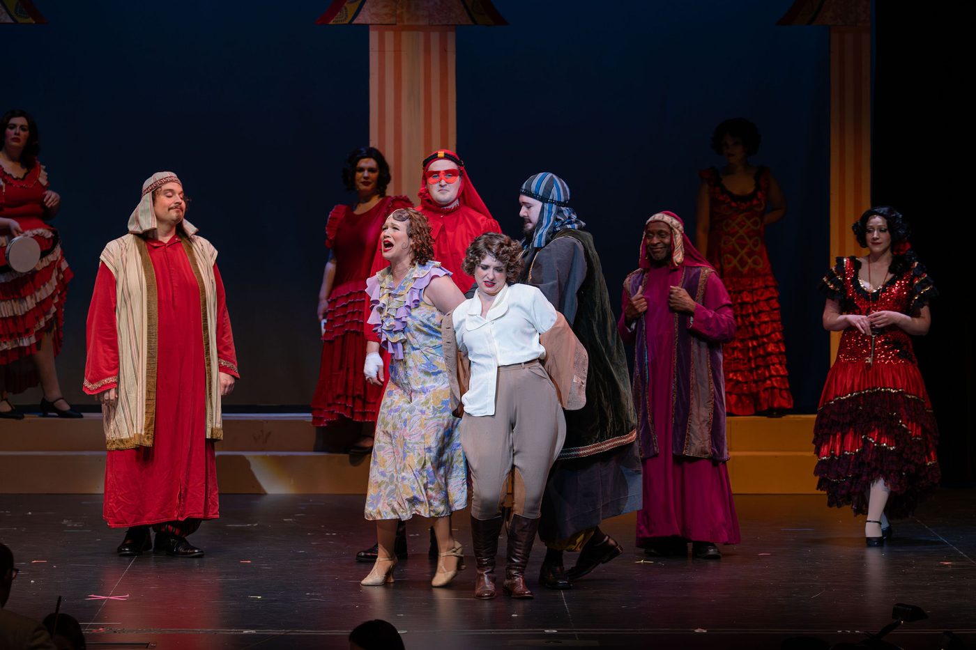 The Riff company in red and striped robes