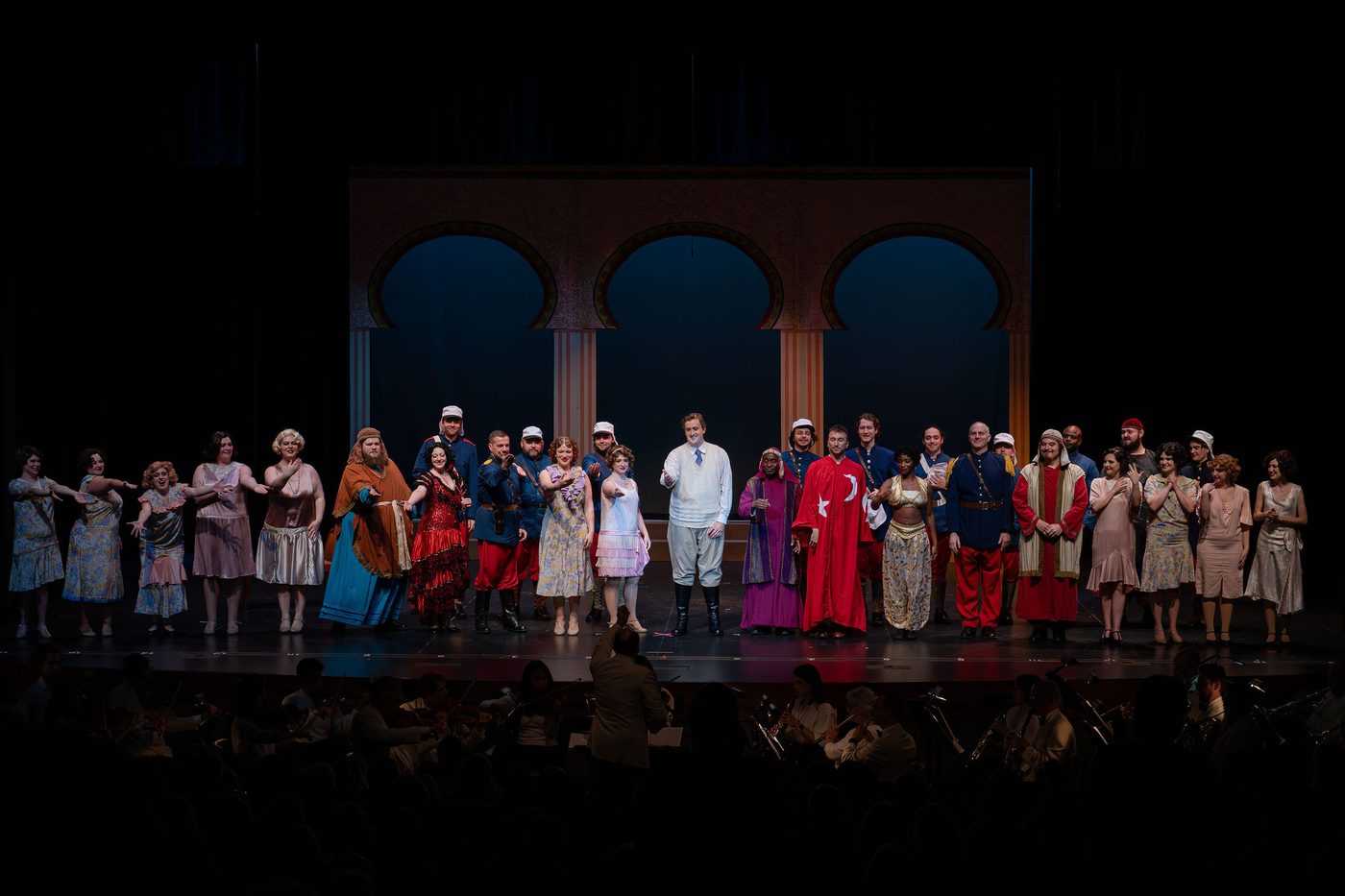 The company at the curtain call, under the arches